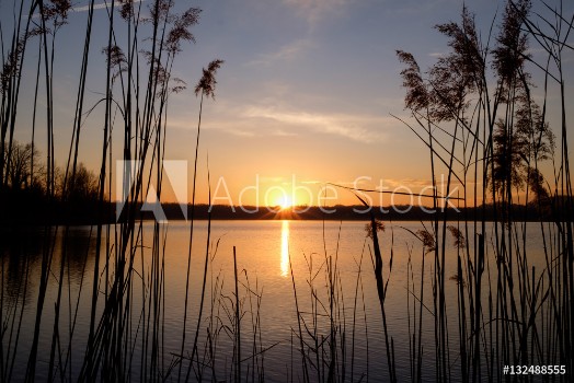 Bild på Sunset at Annone Lake